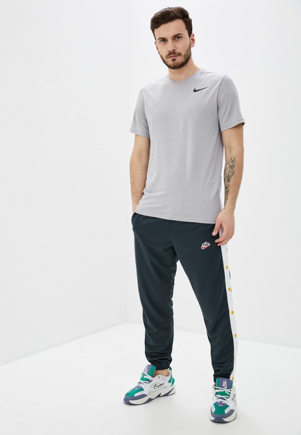 Брюки спортивные Nike M NSW HE PANT TEARAWAY PK, цвет: зеленый,  NI464EMHTXR2 — купить в интернет-магазине Lamoda