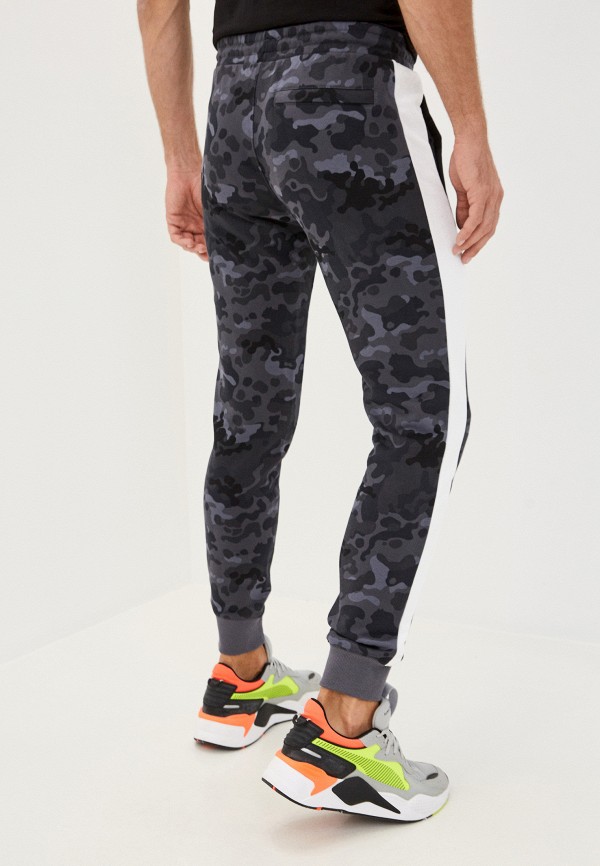 PUMA Брюки спортивные - Classics Graphics AOP Pants - фото 3