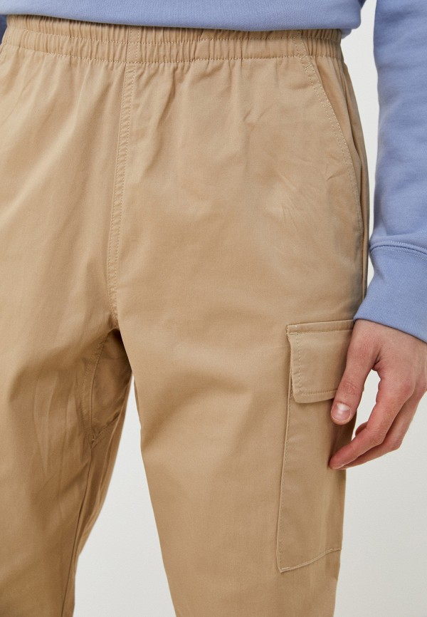 Брюки New Balance NB Athletics Woven Cargo Pant, цвет бежевый