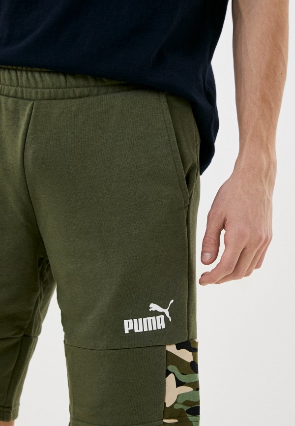 Шорты спортивные PUMA ESS BLOCK CAMO Shorts 10 TR Green Moss цвет хаки RTLACJ321501 купить