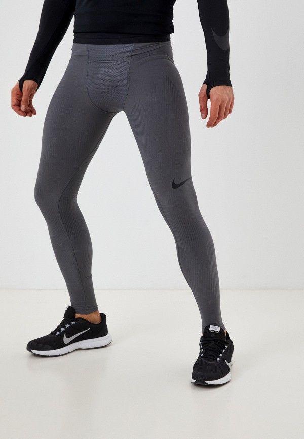 Тайтсы Nike серого цвета