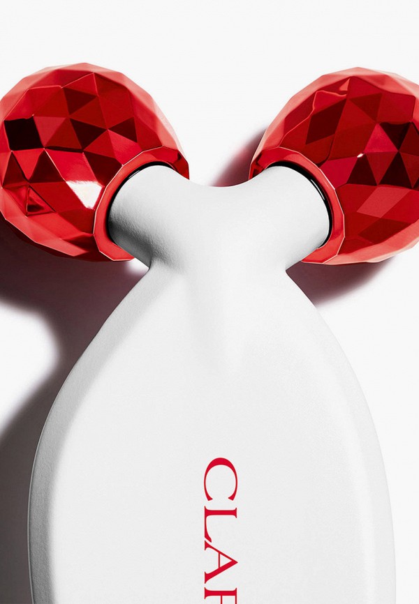 фото Массажер для лица clarins