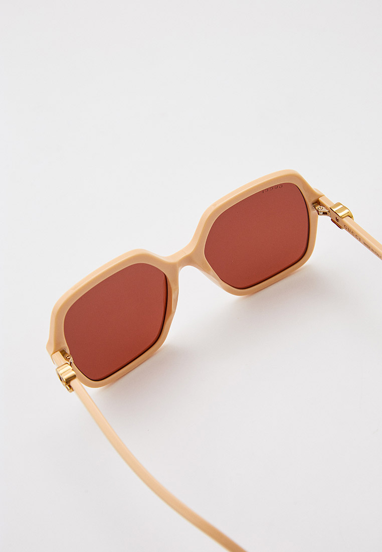 Женские солнцезащитные очки Gucci (Гуччи) GG1072S купить за 32900 руб.