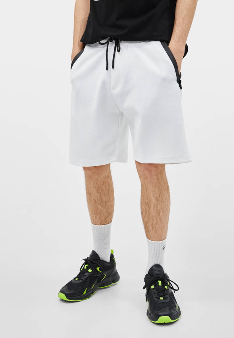 Men in Oversized Bermuda shorts