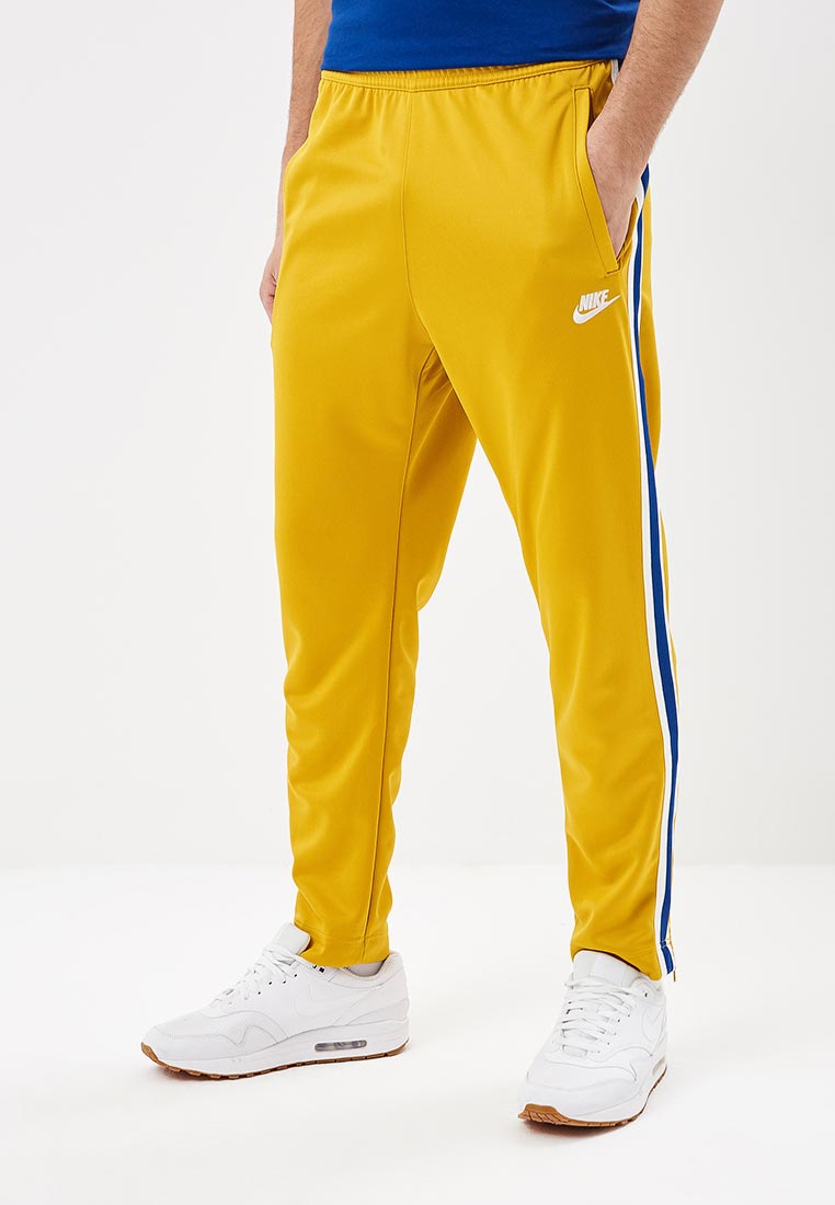 Желтые штаны мужские. Nike Sportswear брюки мужские желтые. Желтые штаны найк. Желтые штаны Nike. Желтые штаны найк мужские.